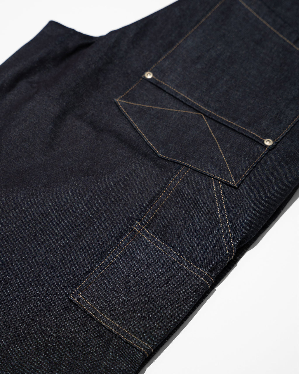 PLEATED RAW INDIGO JORTS